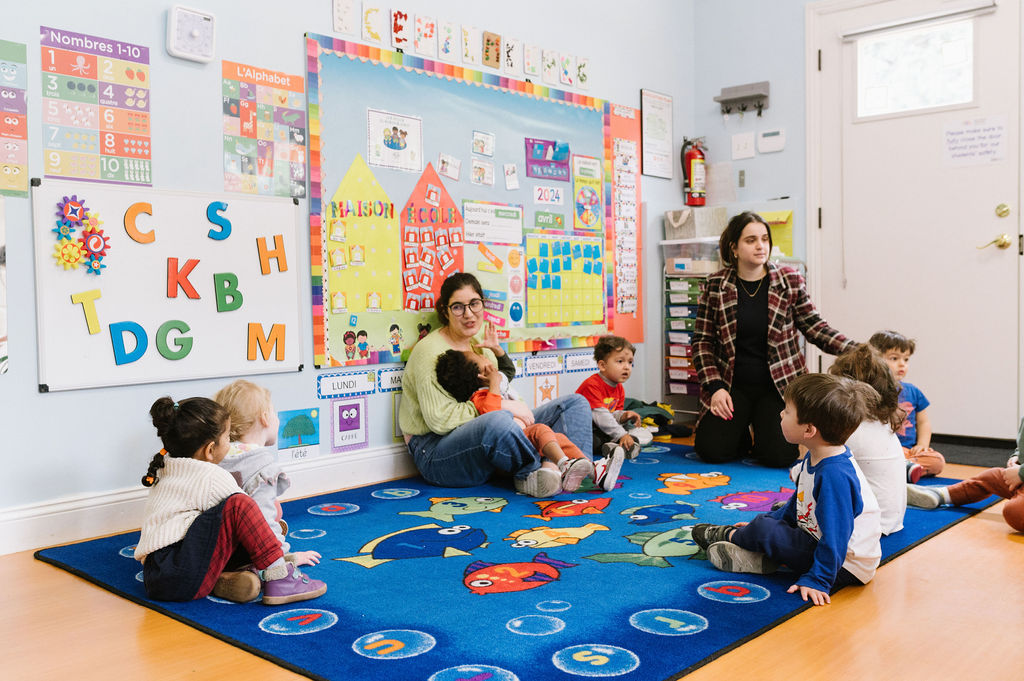 Children playing in preschool with teachers.