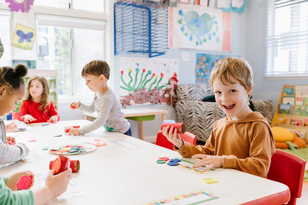 A child showing off his art project