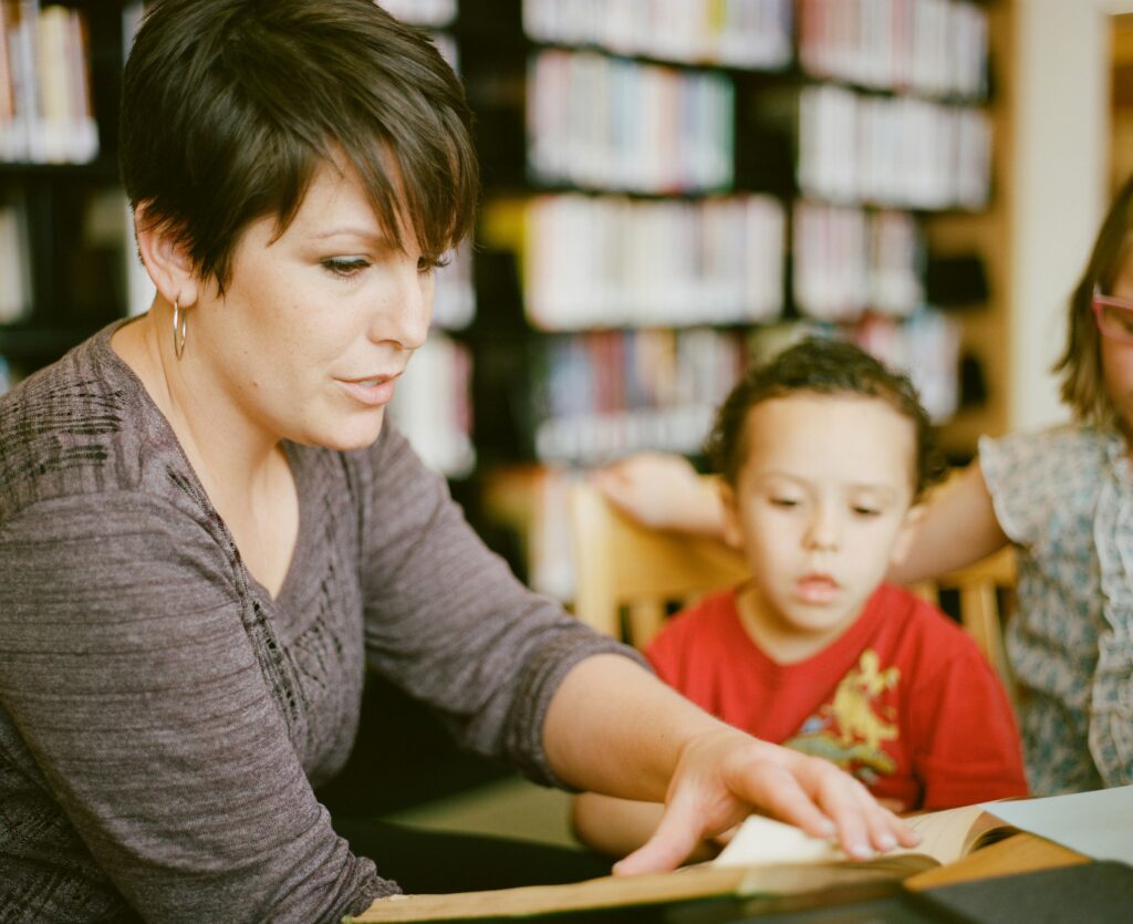 A teacher reading to her students