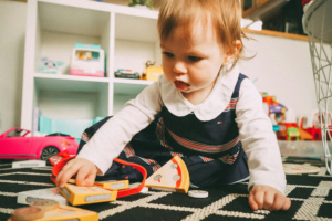 A toddler playing at a daycare